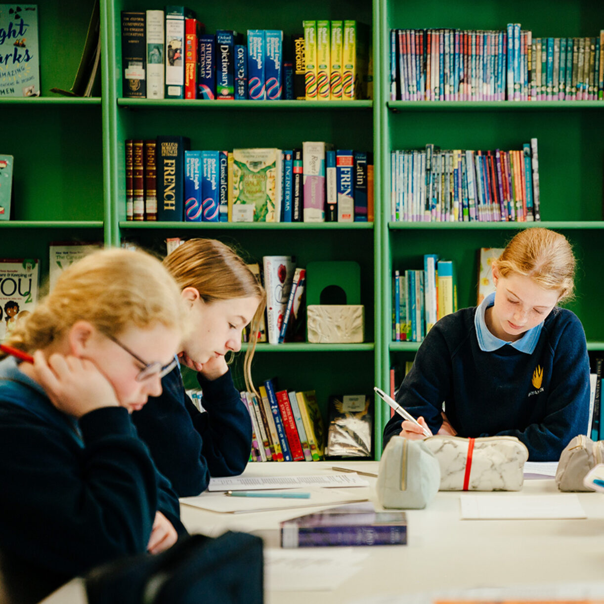 Prep School Girls Studying in Library