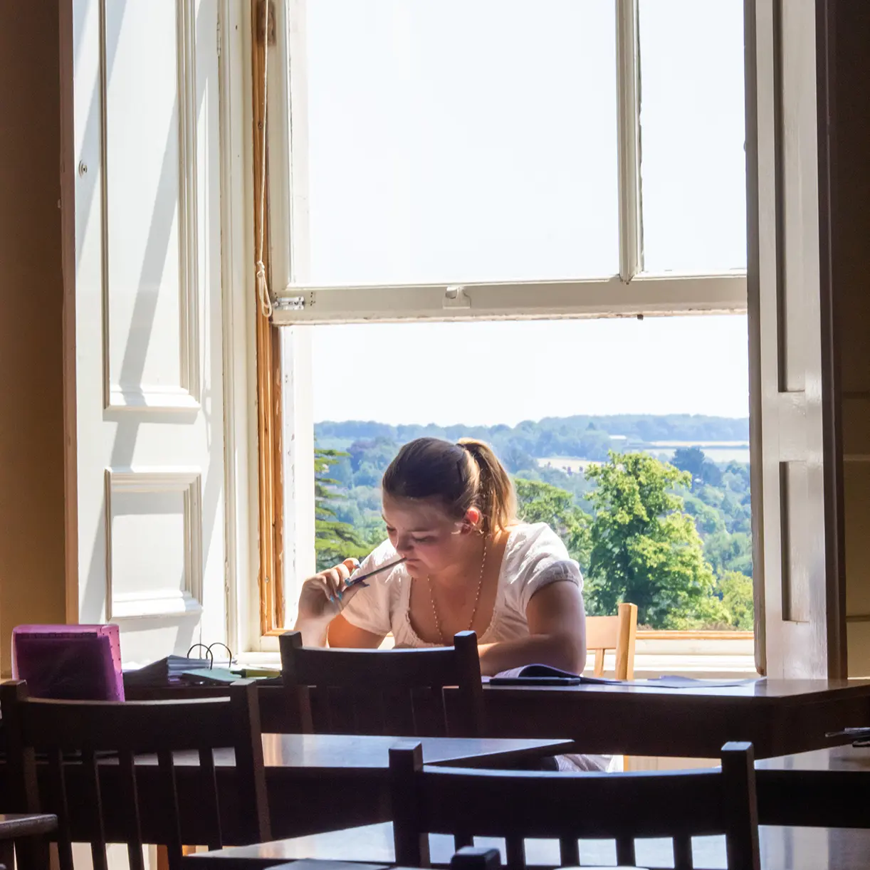 Girl doing prep by window