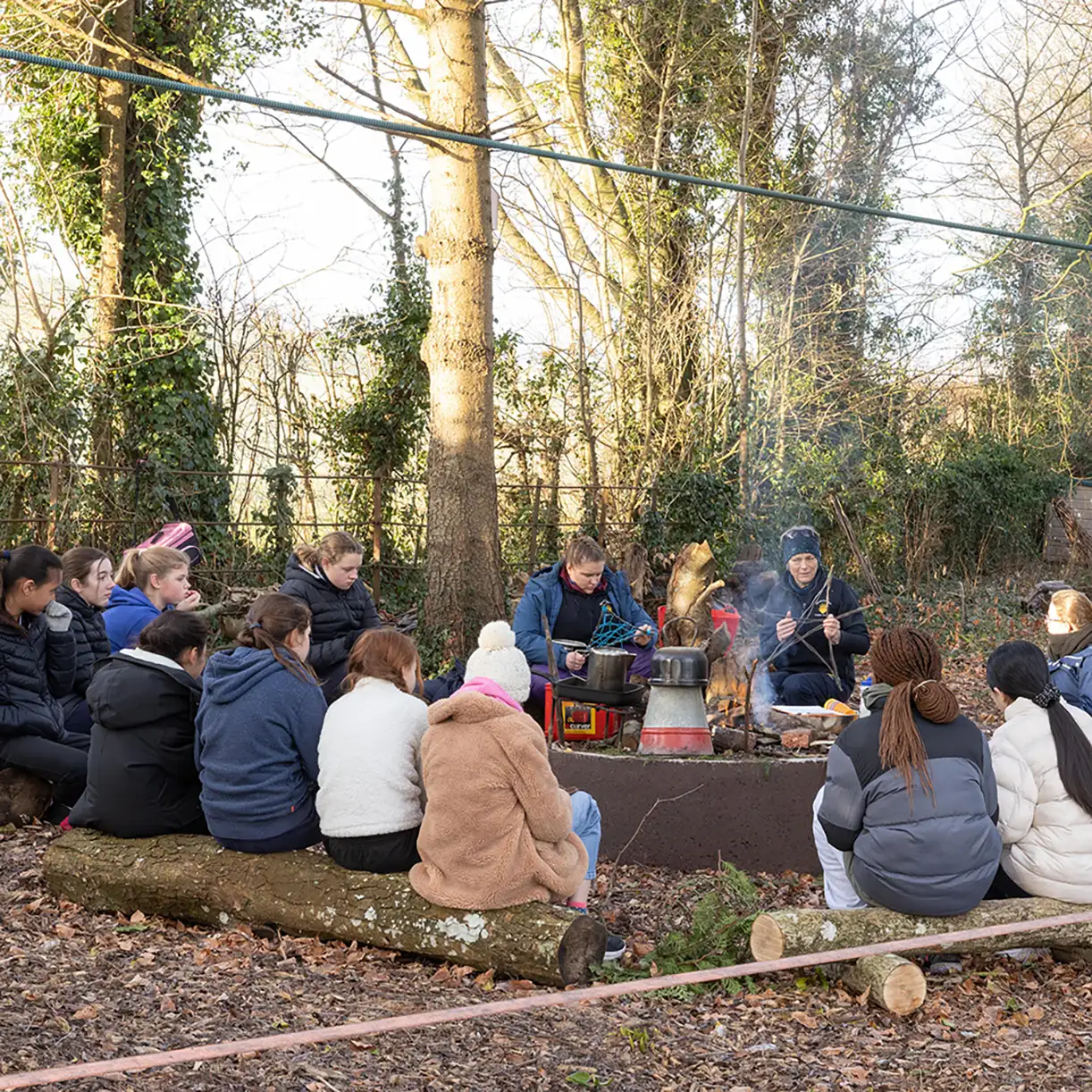 Forest School Children Around Fire