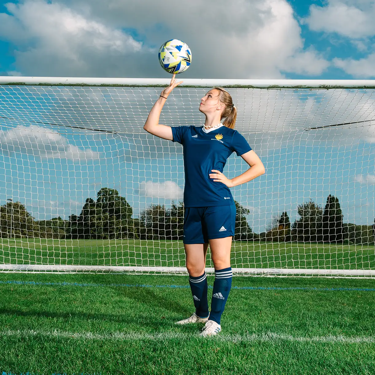 Football girl spinning ball