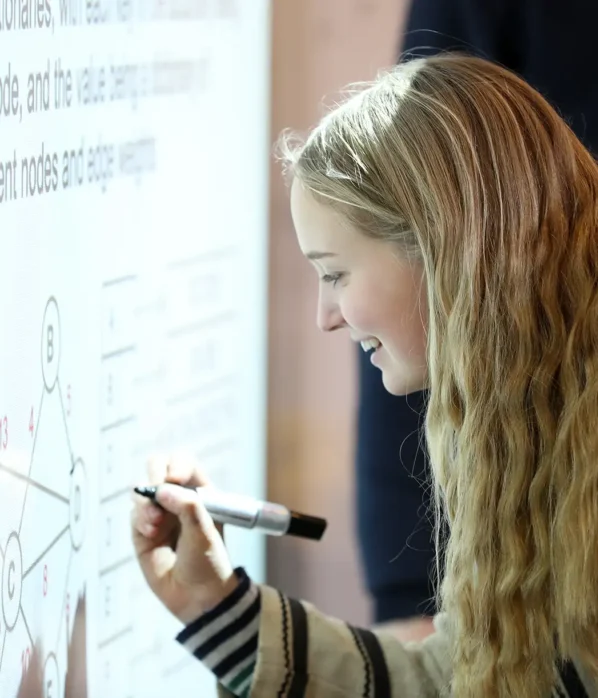 Science whiteboard with pupil writing