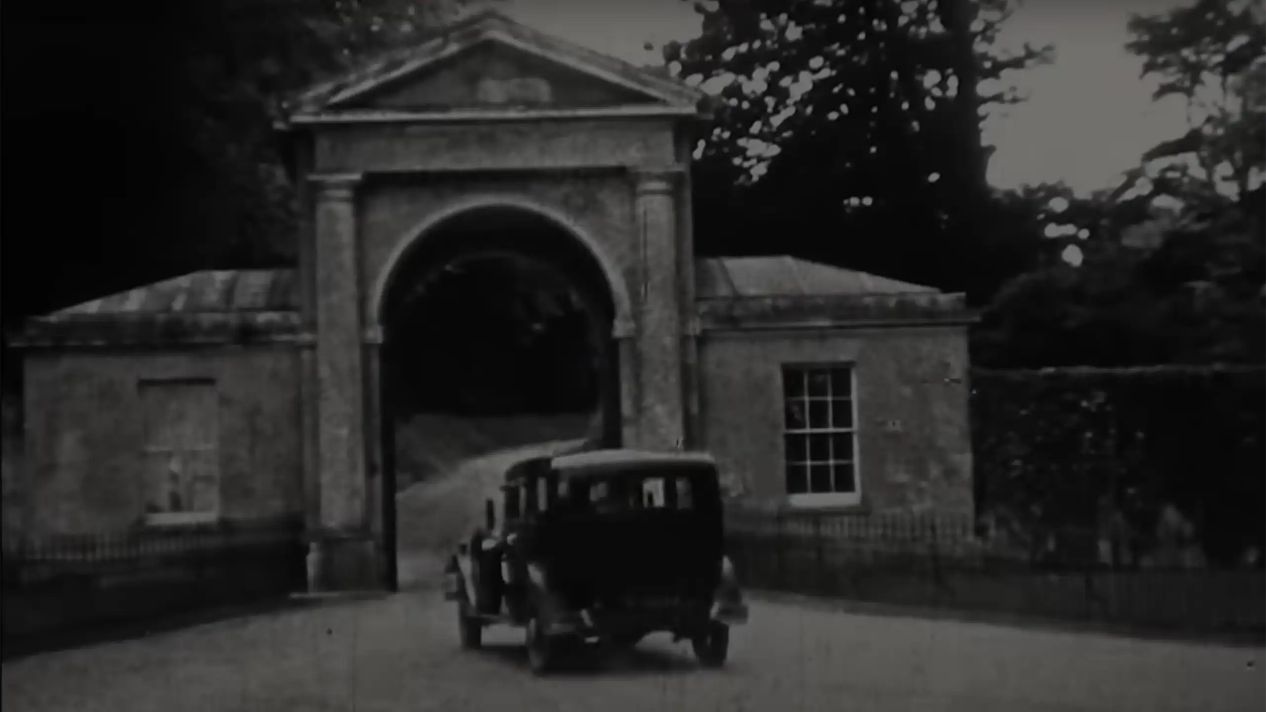 History of the School - Car Going Through Arch