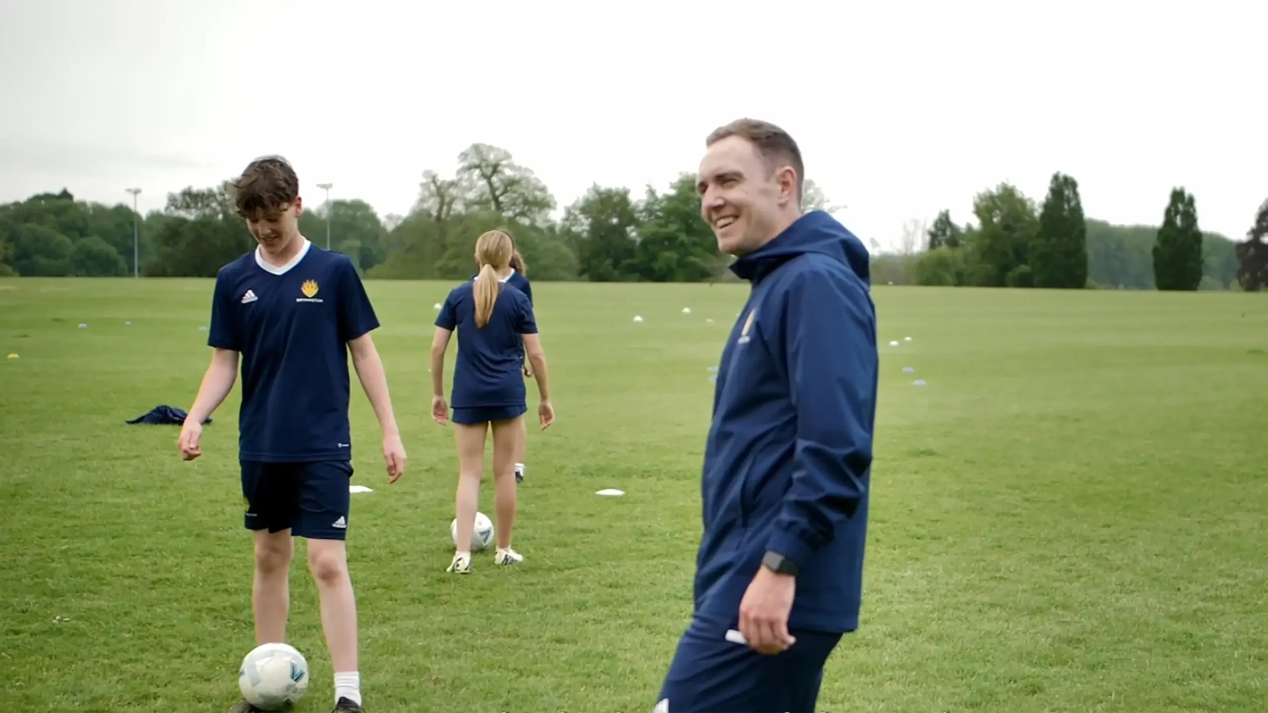 Mark Foster with football boy and girl