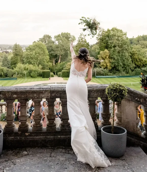 Wedding bride throwing bouquet