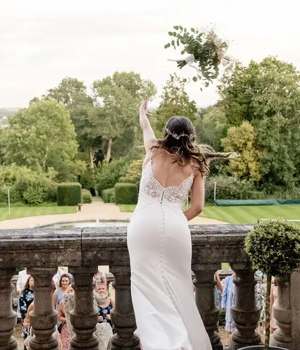 Wedding bride throwing bouquet